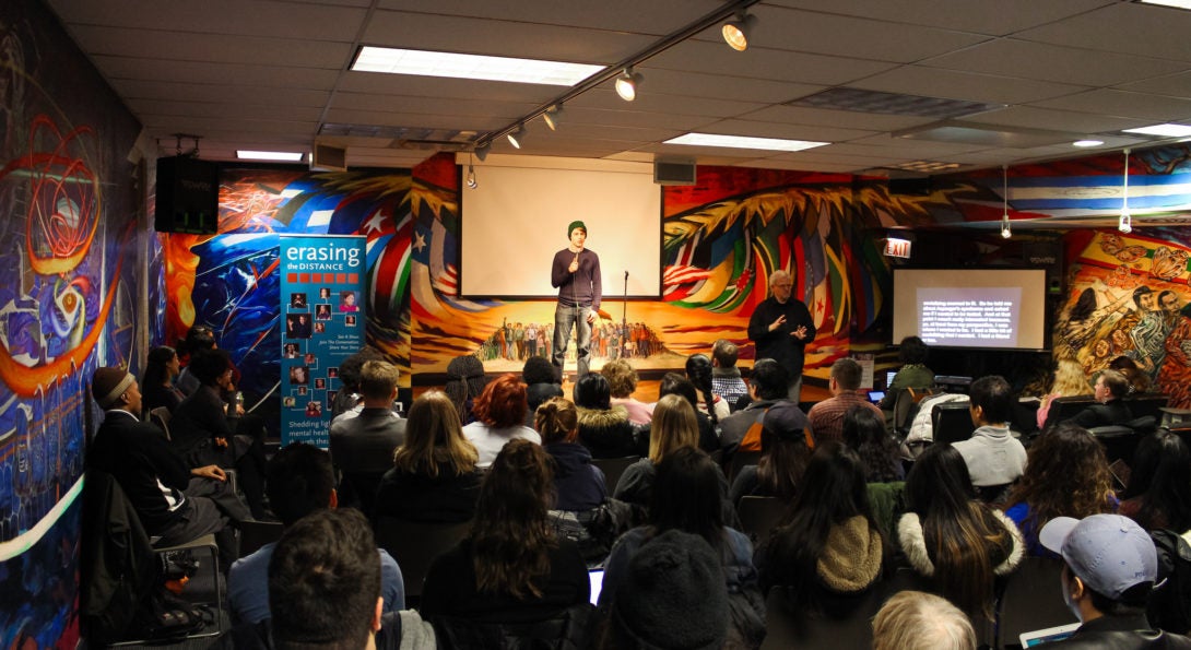 Audience watching speaker on stage