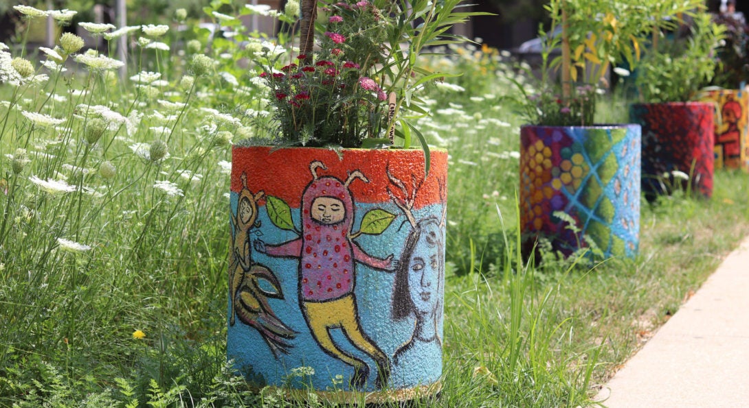 Pollinator urns in garden